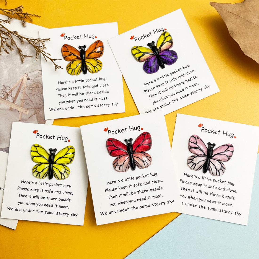 Close-up of Taphug Rainbow Butterfly Pocket Hug showing detailed wing patterns