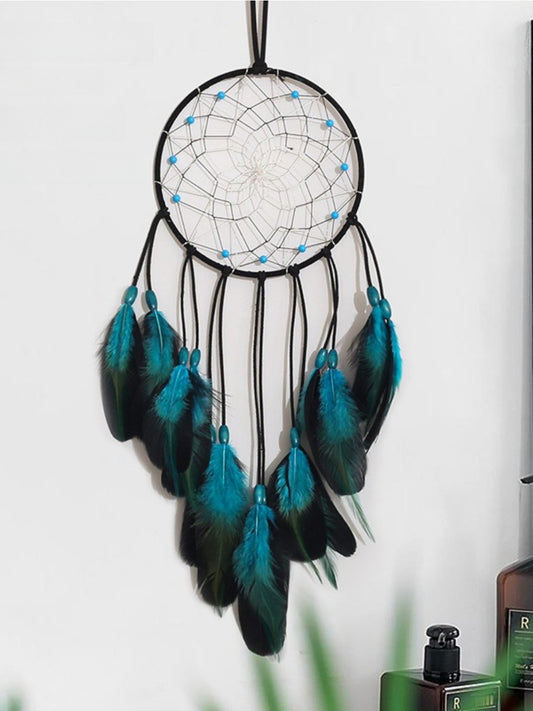 Blue feather dreamcatcher wall hanging with intricate web and wooden hoop