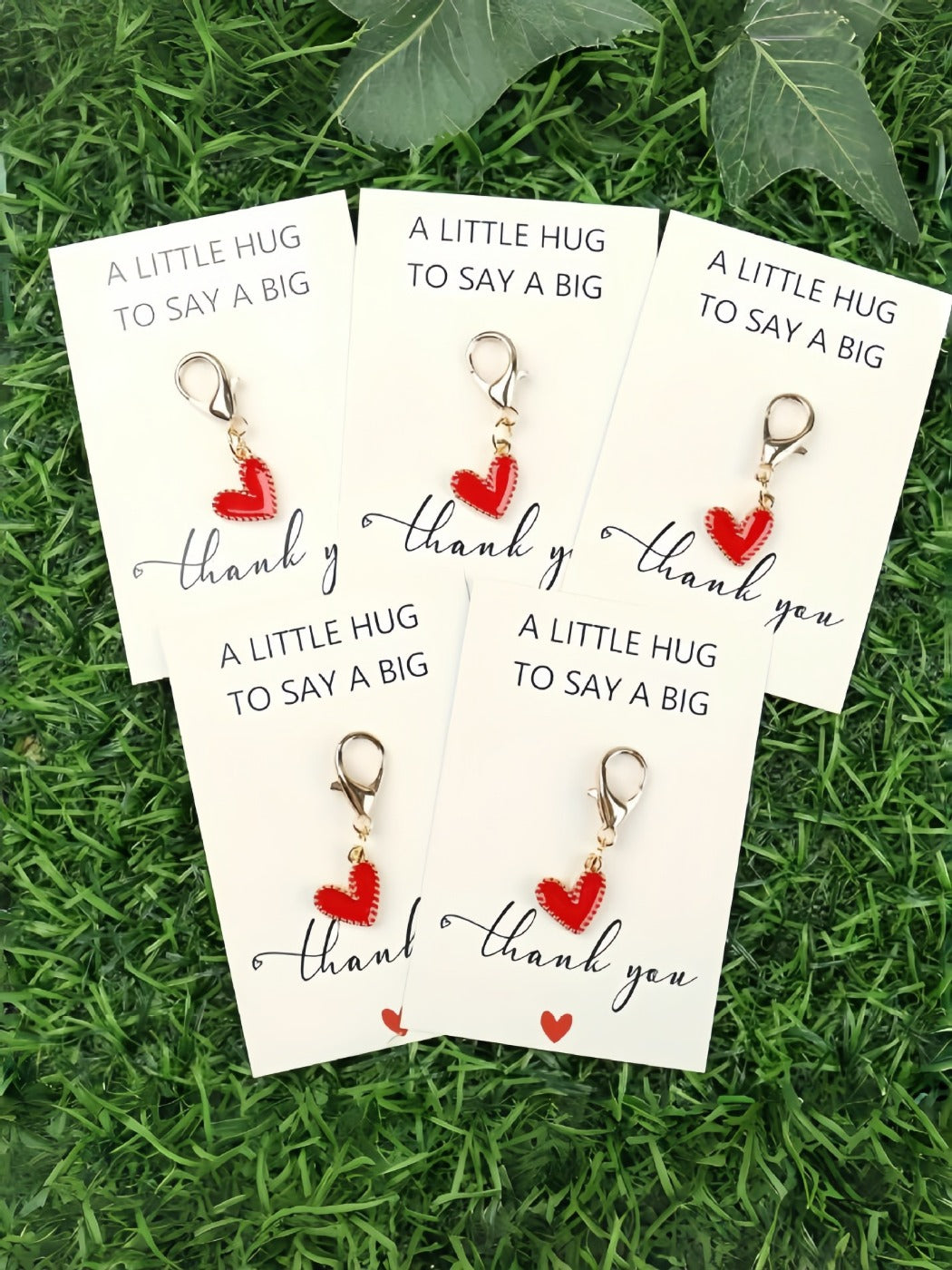 Taphug Pocket Hug keychain with vibrant multicolor heart on a plain surface