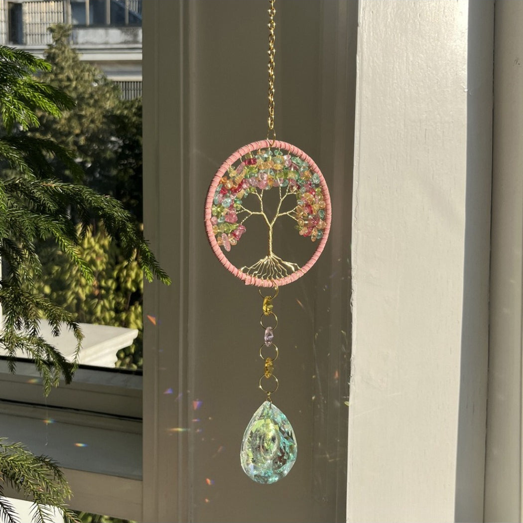 Somnira Tree of Life Dreamcatcher Suncatcher displayed flat on a wooden surface