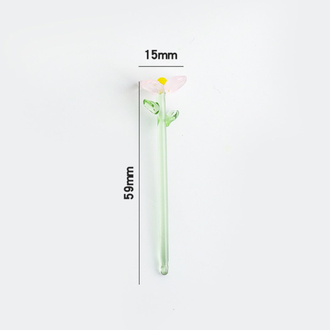 Thimara mini glass daisy displayed in a small glass container