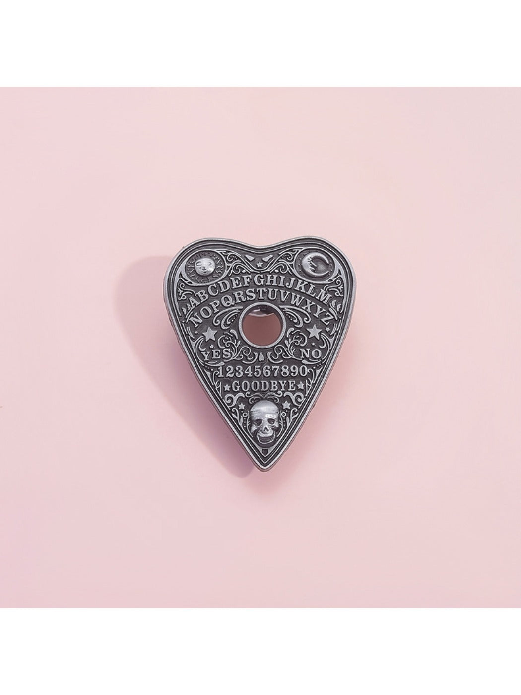 Side view of Pinori black punk metal heart pin badge highlighting thickness