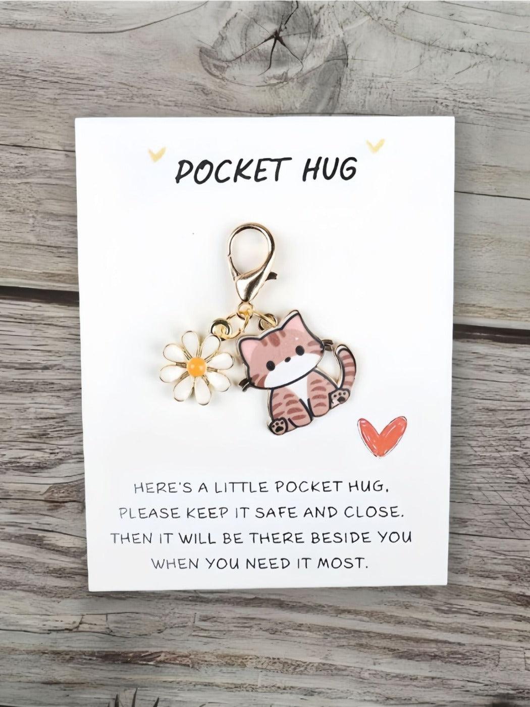 Taphug Pocket Hug keychain with cartoon cat charm shown from a side angle