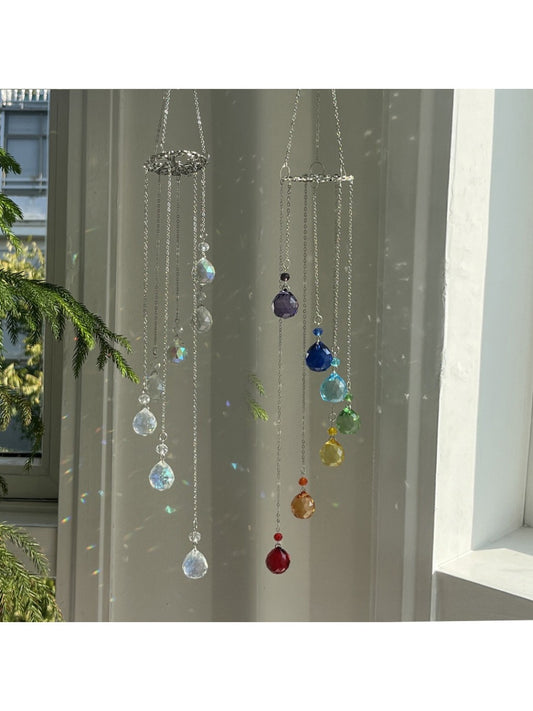 Somnira Life Tree wind chime with seven colorful crystal pendants hanging from a wooden ring