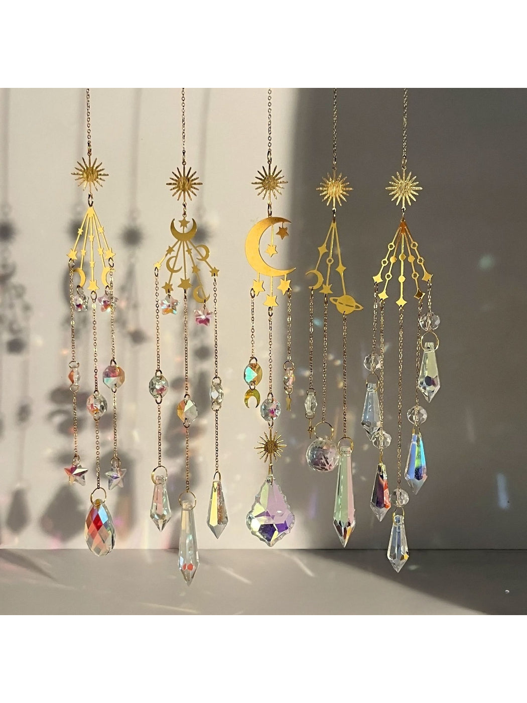 Somnia Star Moon Rainbow Sun Catcher hanging with colorful light reflections