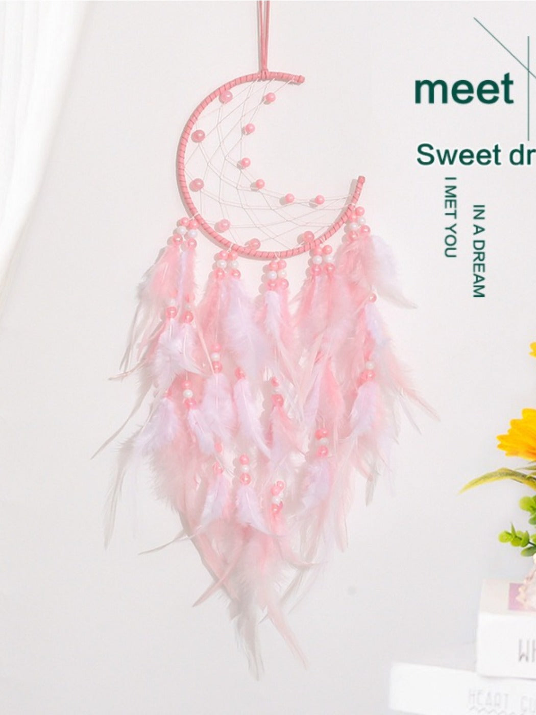 Side view of Somnira moon shaped dream catcher showing detailed weaving