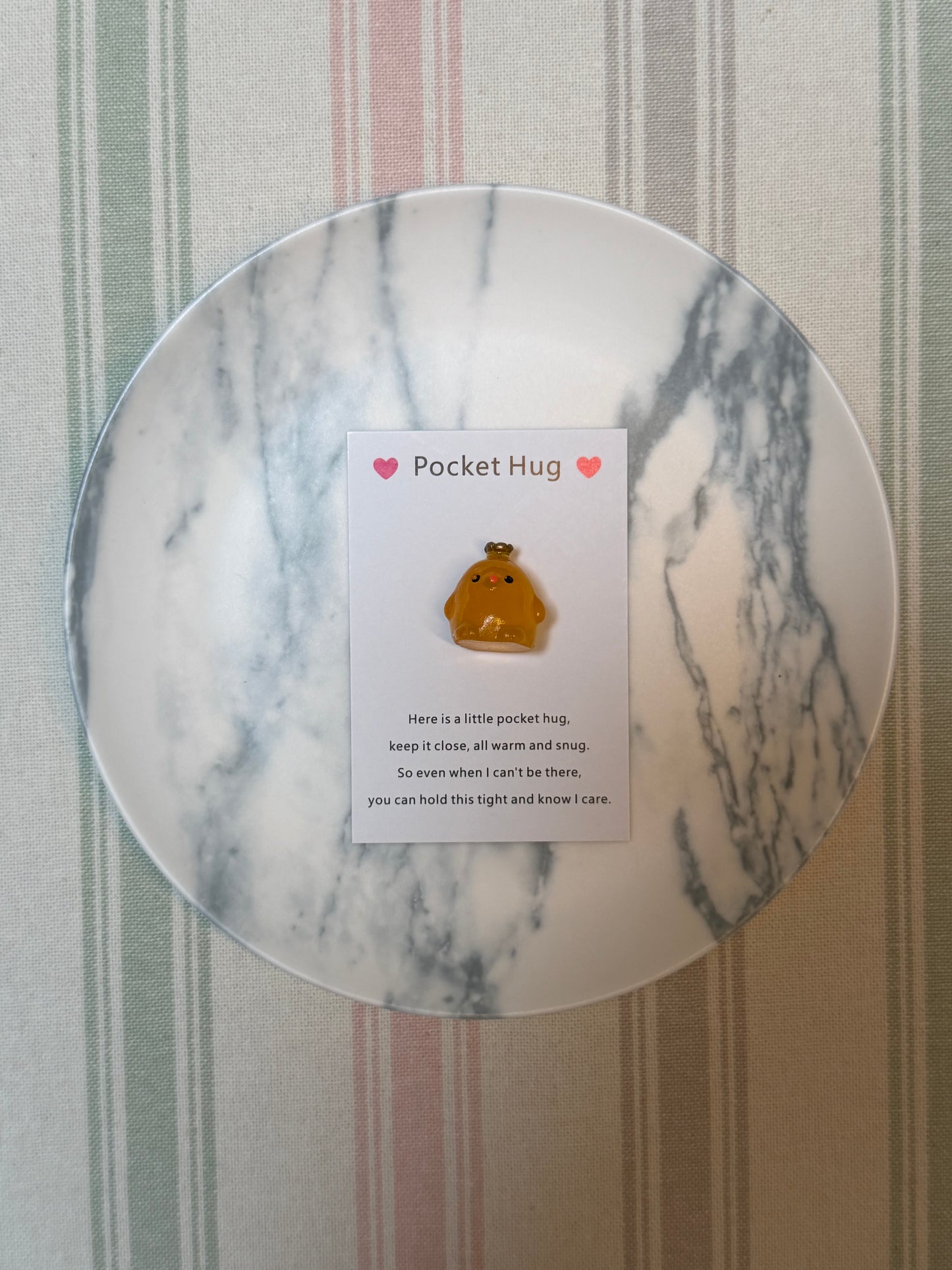 Polybag packaging and hangtag for the Taphug pocket hug card product