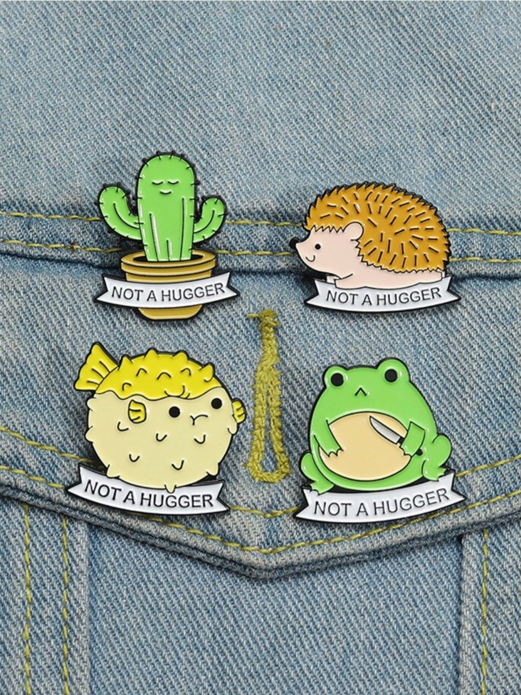 Back of enamel pin showing metal clasp and pin attachment