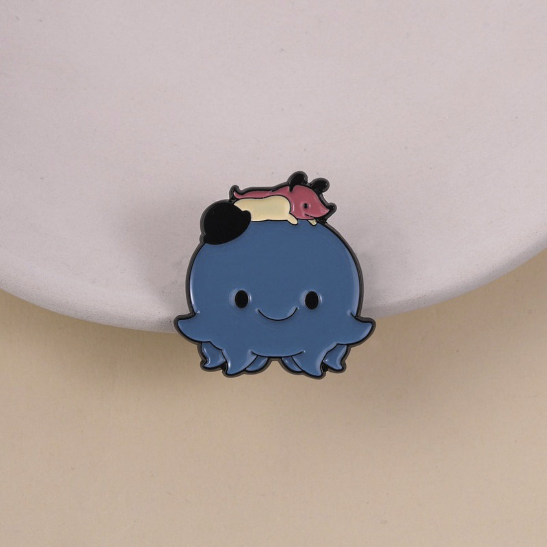 Close-up of Pinori Tiny Friend Octopus Pin showing detailed tentacles and face