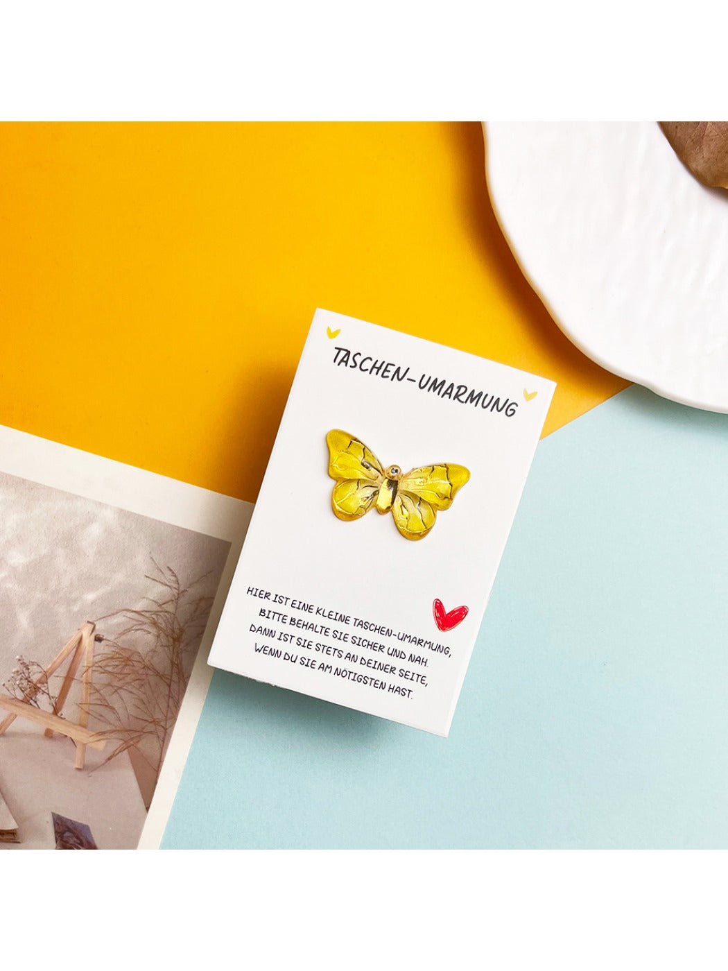 Taphug card with butterfly design placed on wooden surface