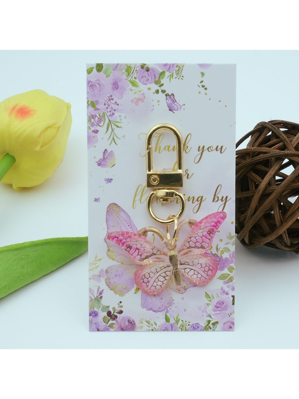 Close-up of Taphug butterfly acrylic keychain showing gradient colors