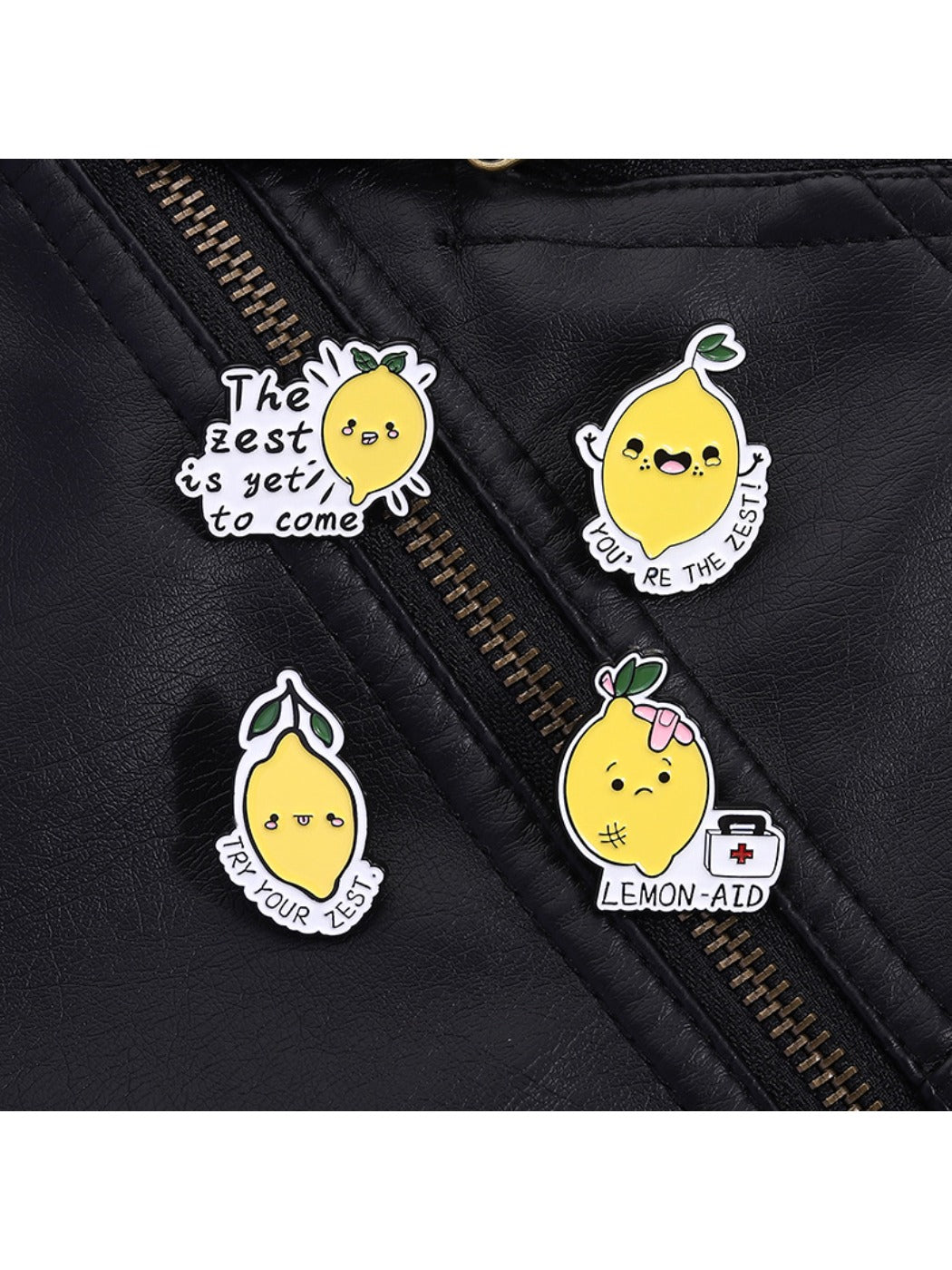 Pinori cartoon lemon brooch held in hand to demonstrate scale and detail