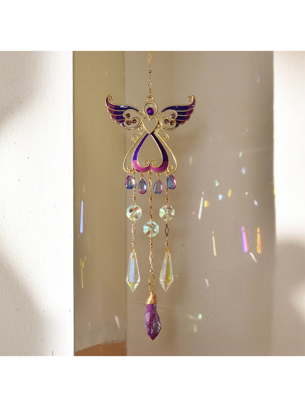 Somnia Angel Wing Crystal Sun Catcher shown in a decorative indoor setting