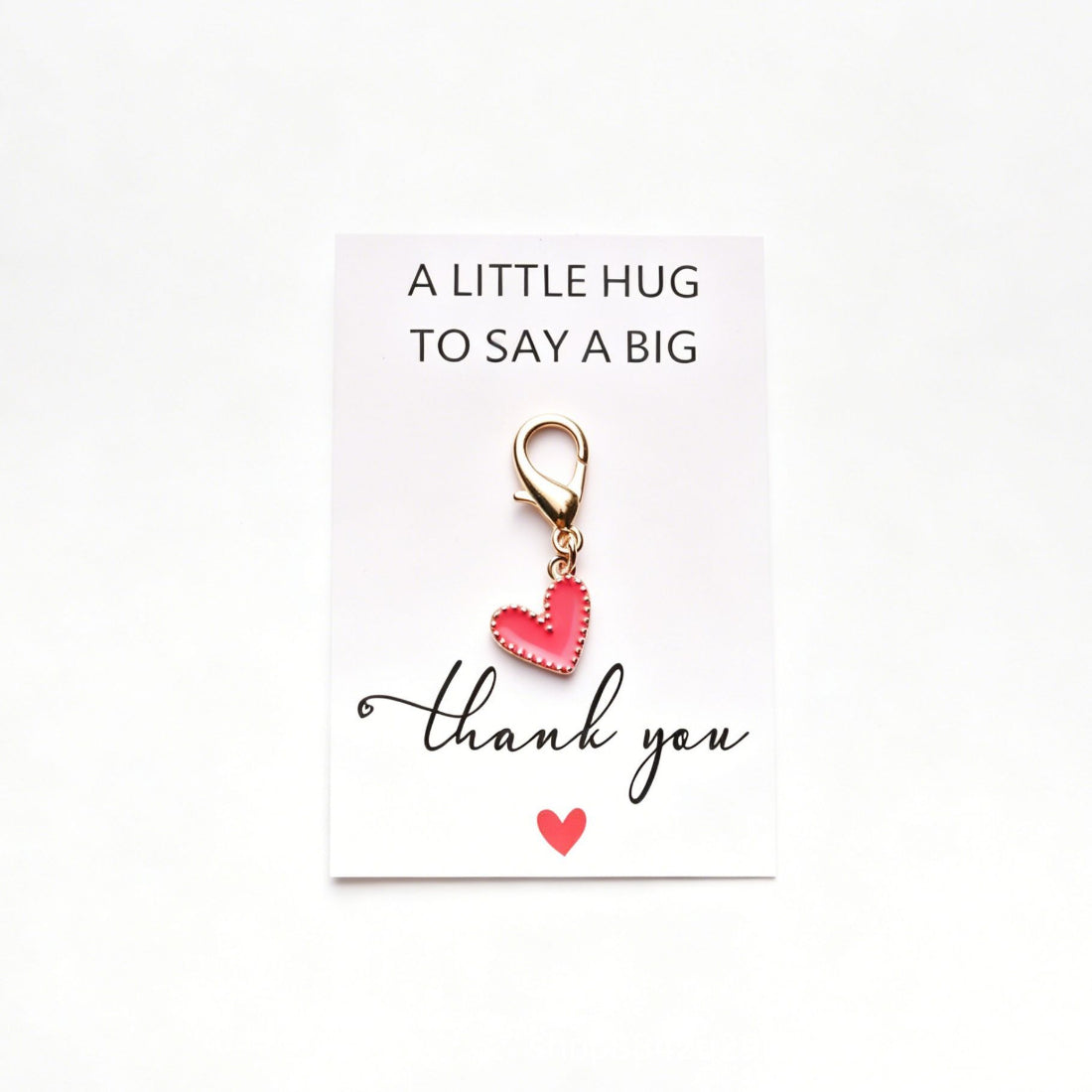 Taphug heart pocket hug plush toy displayed on white background