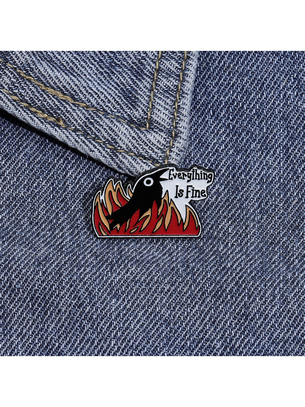 Top view of the raven brooch displaying intricate flame details