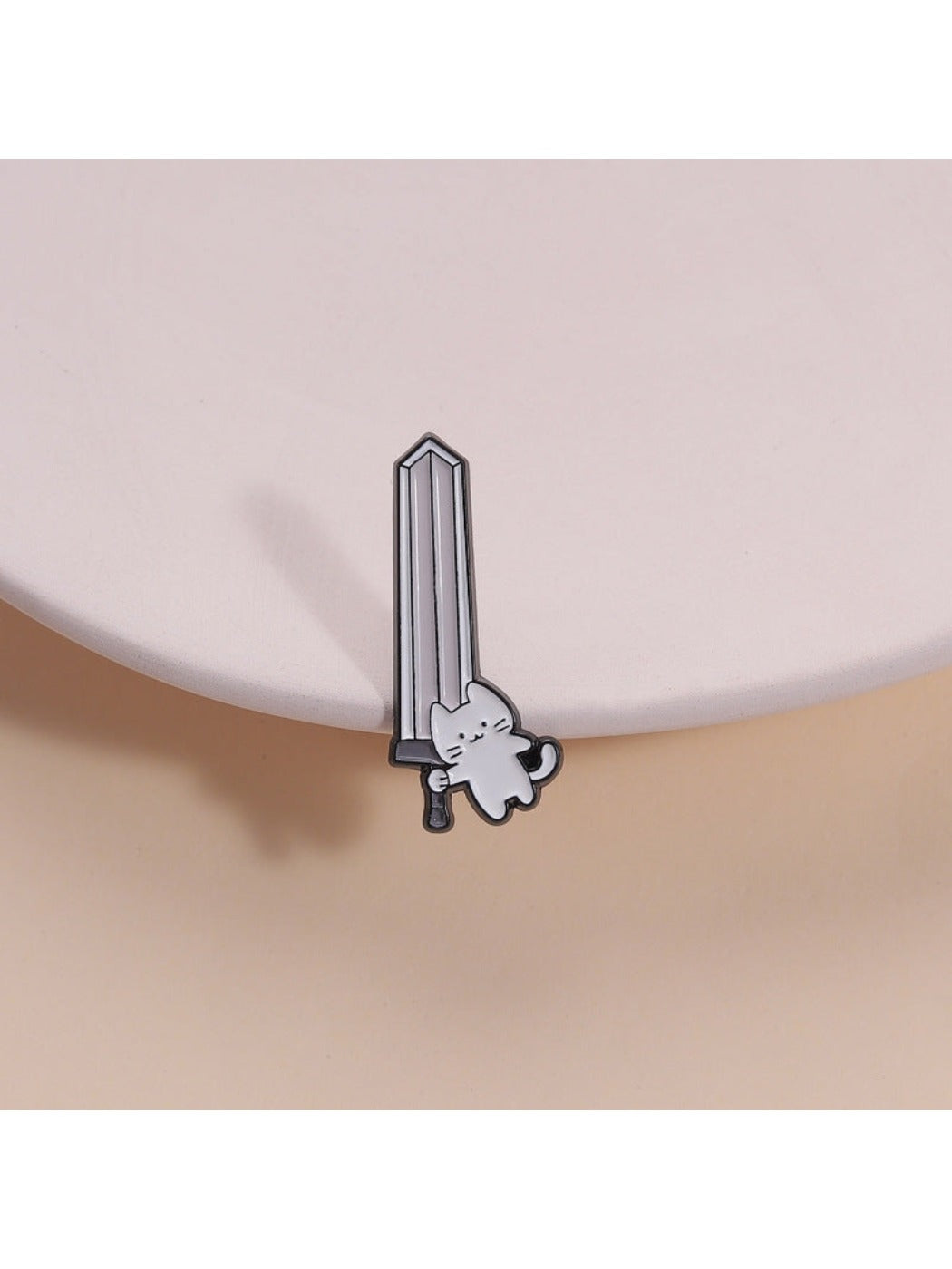 Pinori funny fighting cat brooch showing a playful cat design in metal