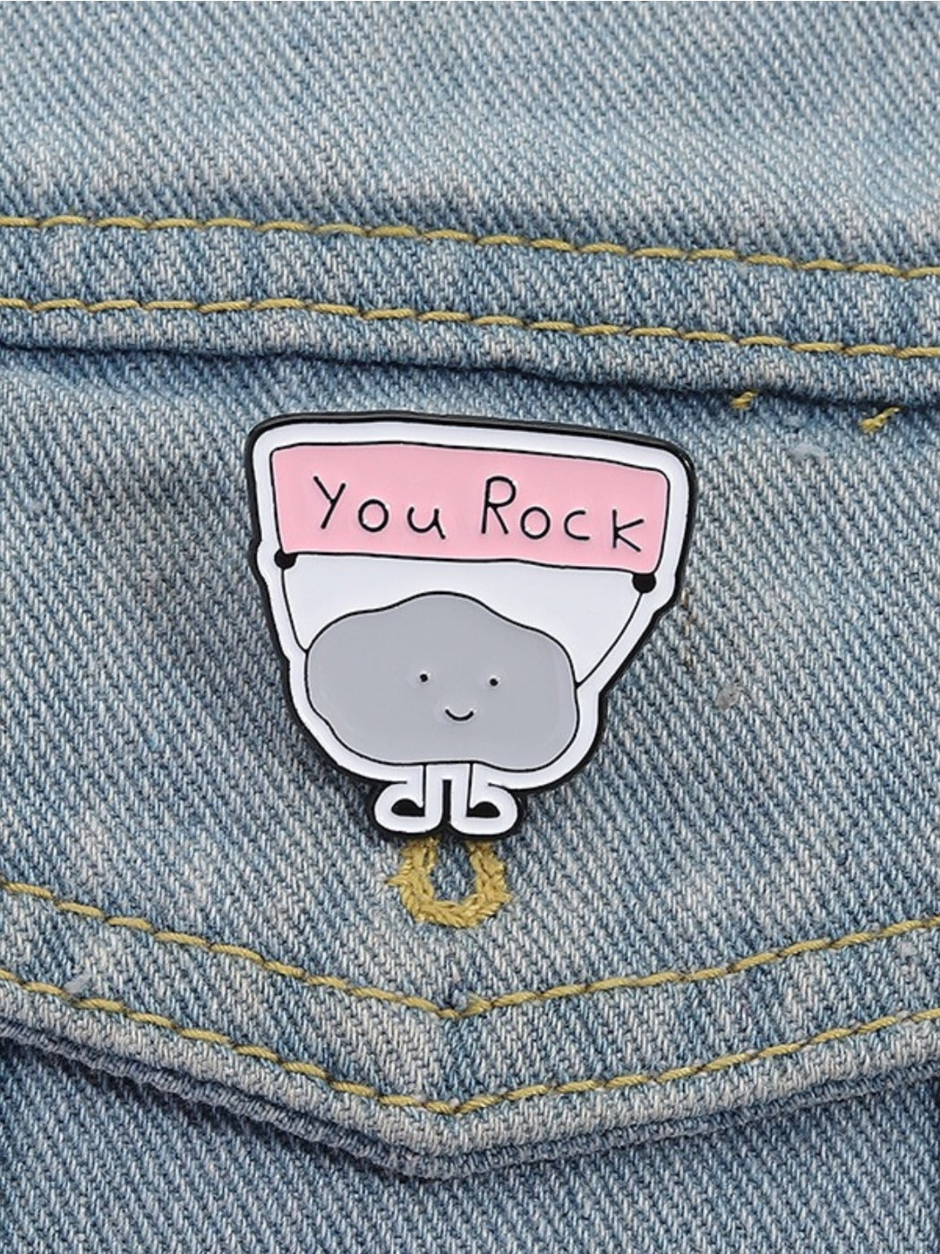 Pinori YOU ROCK motivational pin attached to a backpack strap