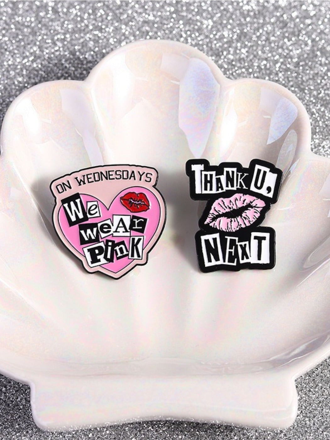Side view of pink heart alphabet metal pin showing thickness and metal finish