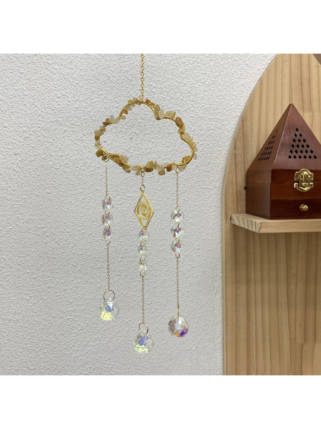 Somnia Cloud Crystal-Look Hanging Sun Catcher suspended against a white background