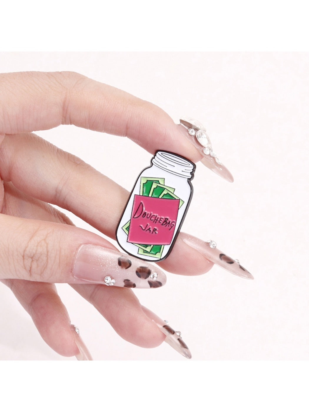Pinori badge pin attached to fabric, showcasing size and design on clothing