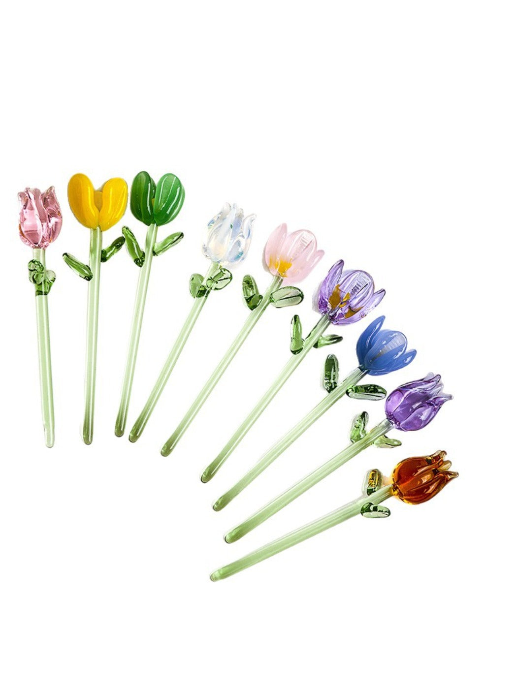 Multiple Thimara mini glass flowers displayed on a wooden surface
