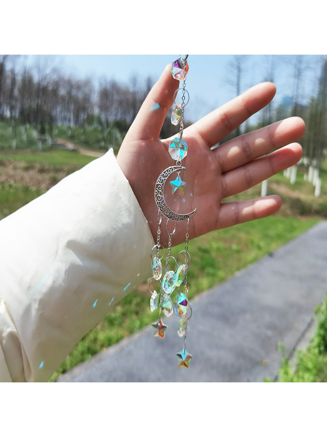 Side view of golden moon dream catcher highlighting feather and bead arrangement