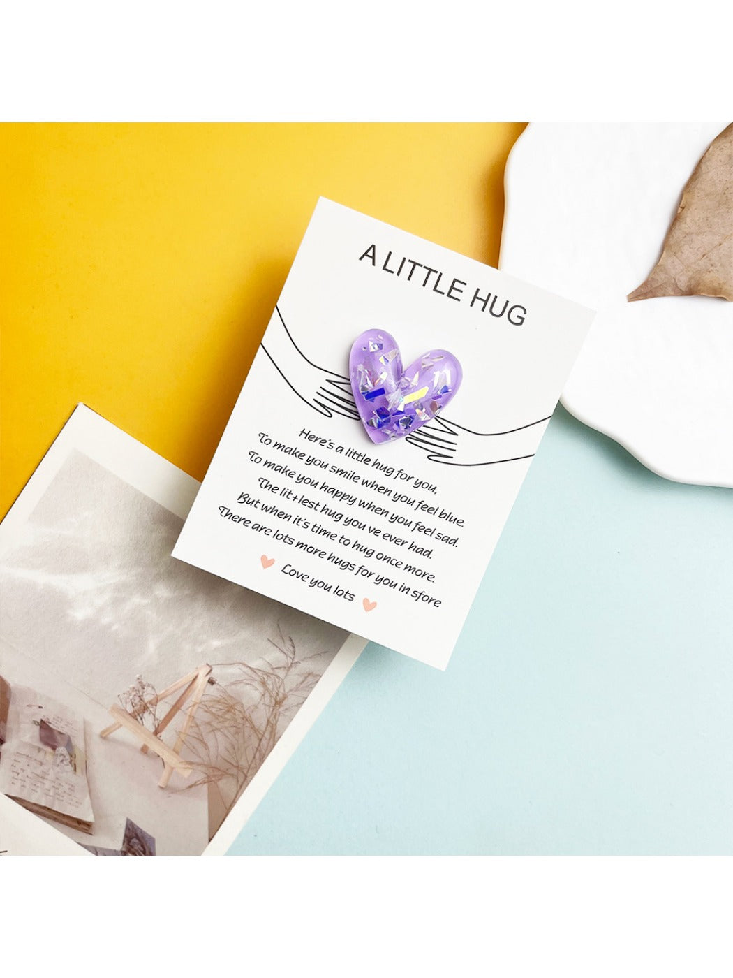 DIY Glitter Heart Pocket Hug Card displayed with crafting tools