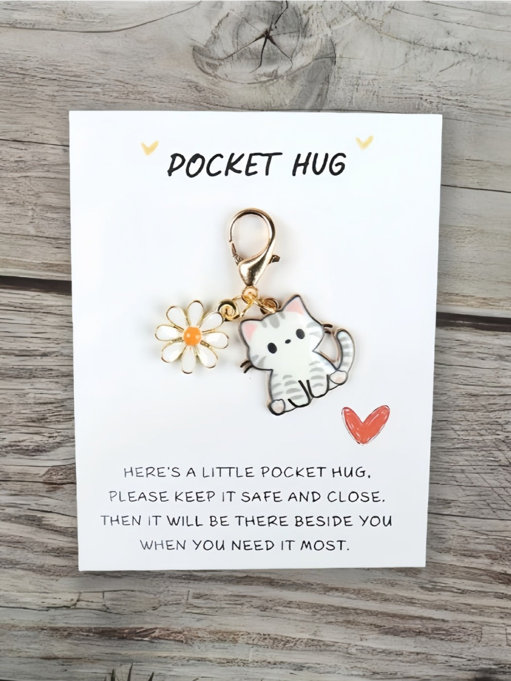 Taphug Pocket Hug keychain with cartoon cat charm attached to a metal ring