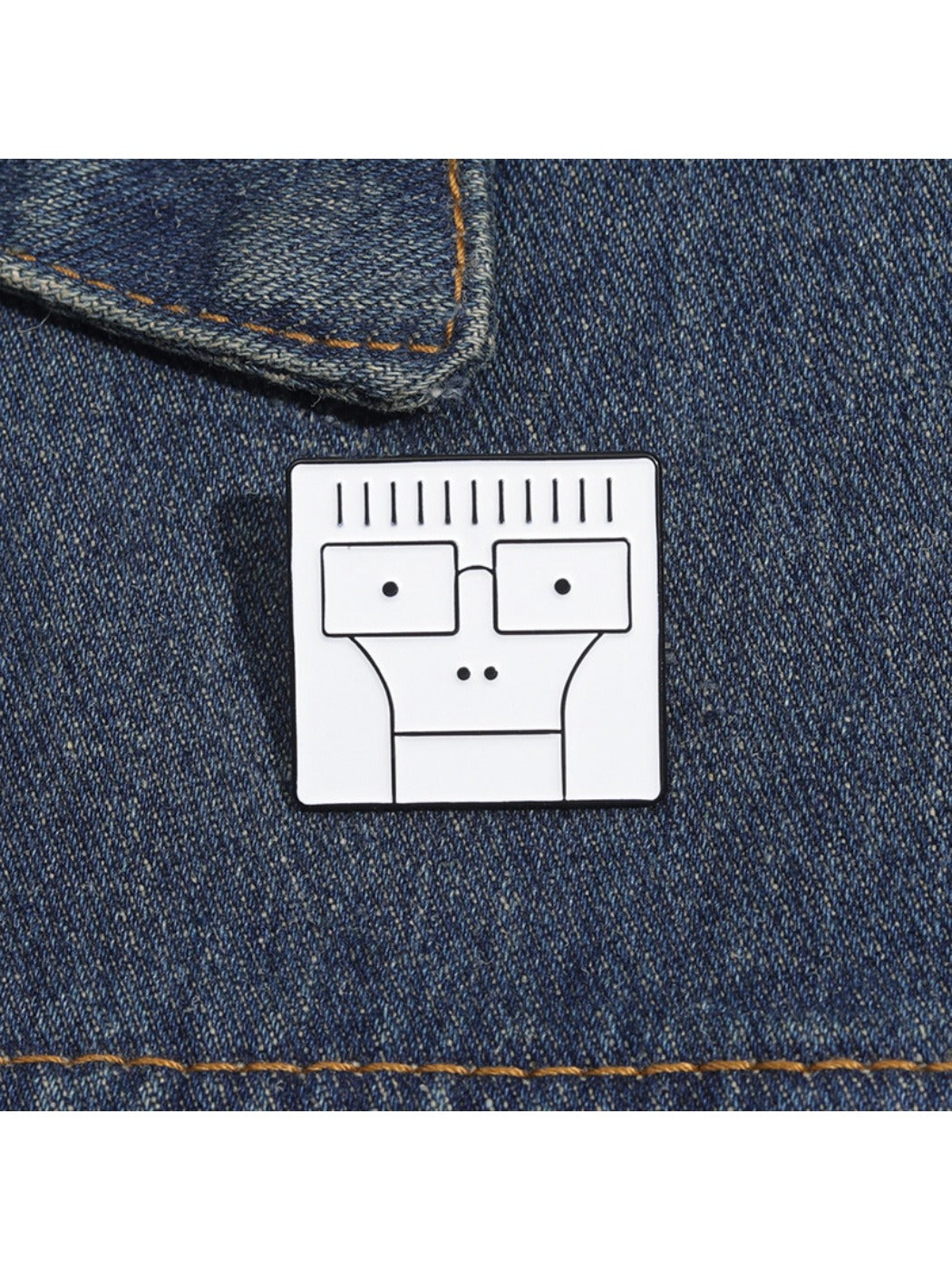 Cartoon character pin attached to a corkboard with other pins in the background