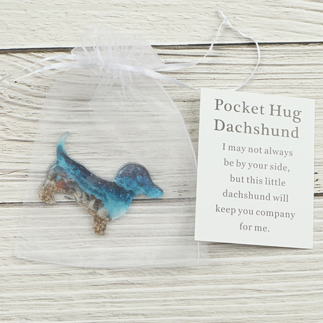 Taphug Little Dachshund Pocket Hug plush held in hand to show size and softness