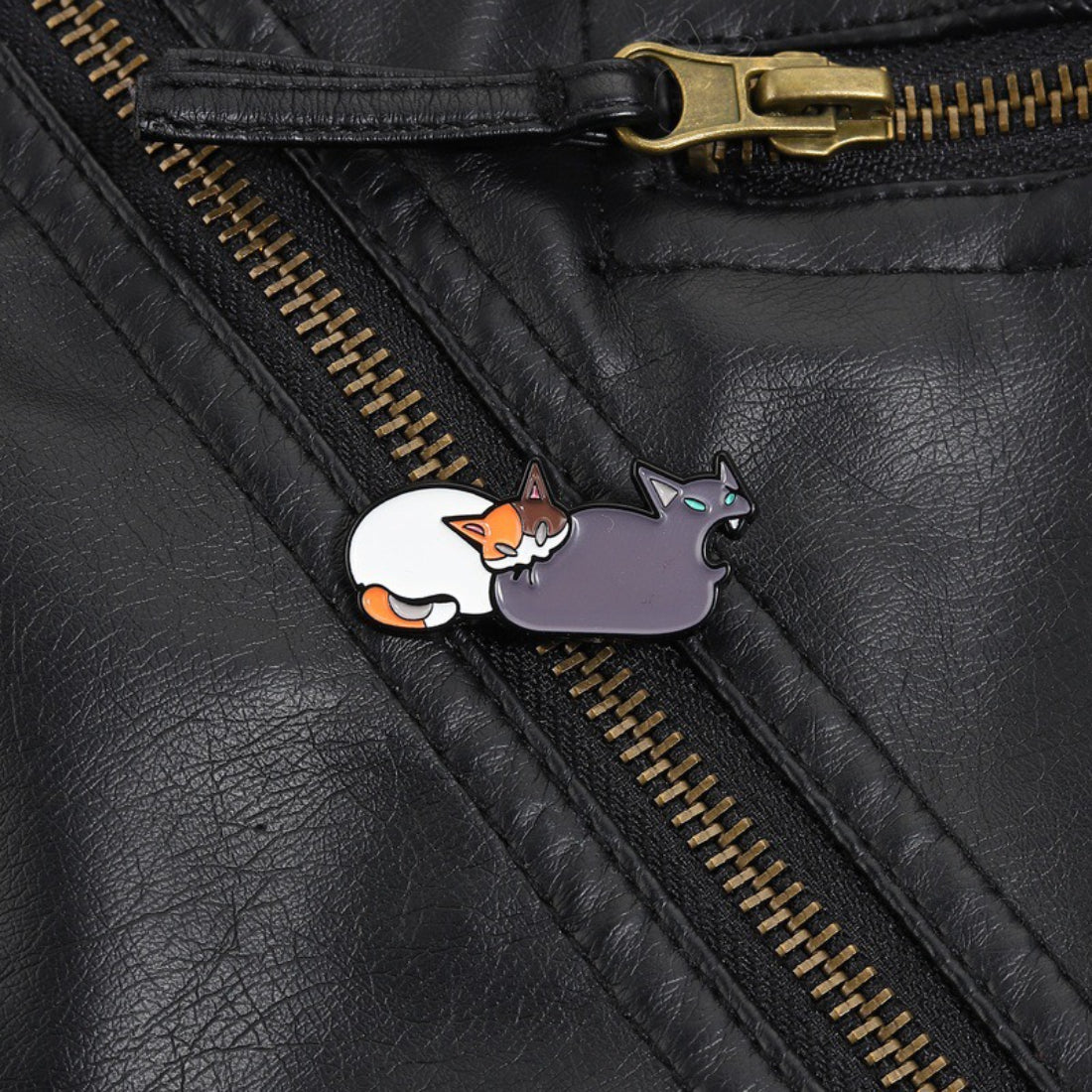 Pinori cat butt bite enamel pin displayed on a white background highlighting design details