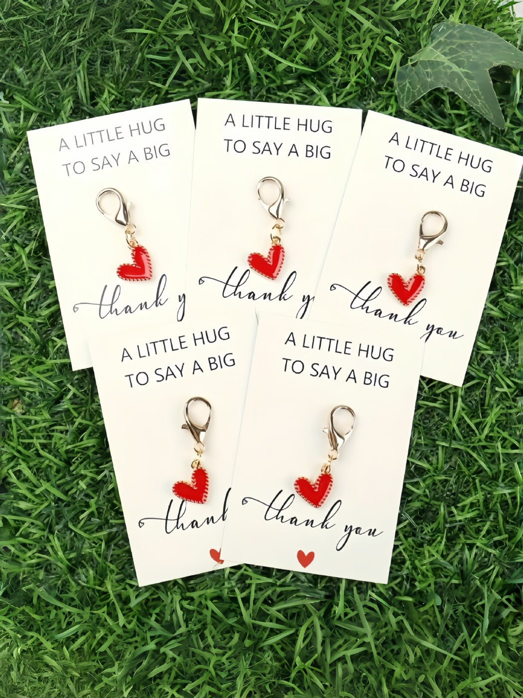 Taphug Pocket Hug keychain with colorful heart design on a white background