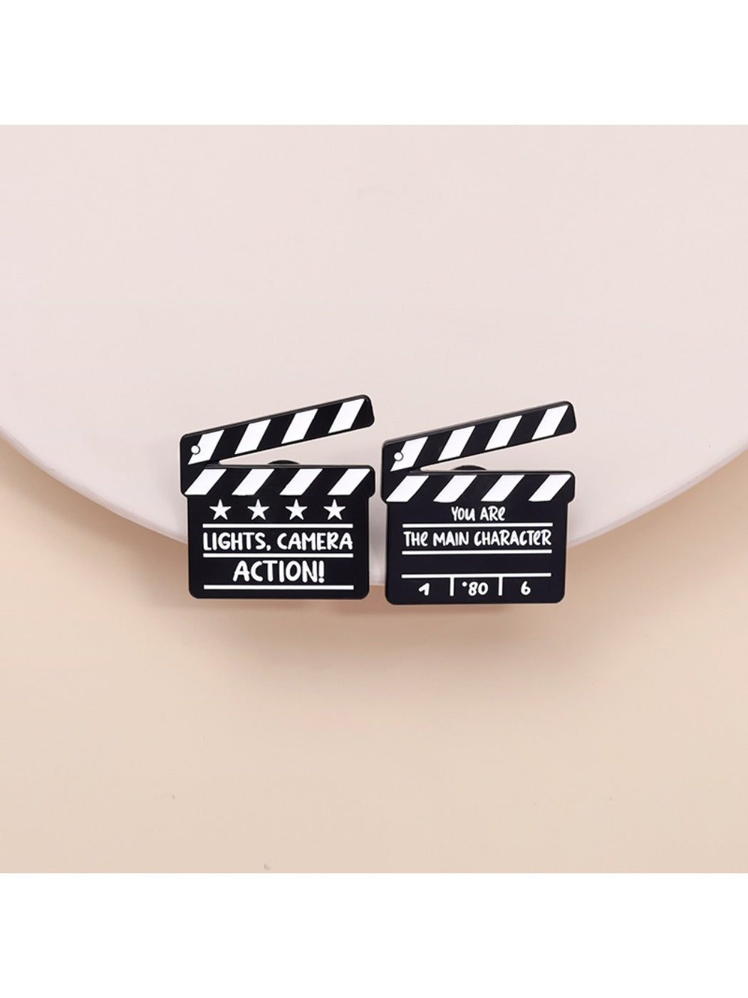 Pinori funny TV series clapperboard brooch on white background