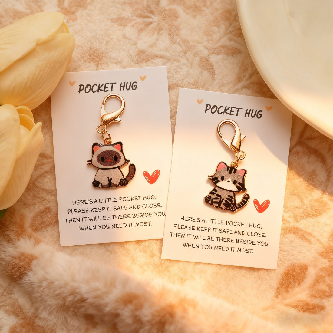 Close-up of Taphug Kitten Charm showing detailed stitching and soft texture