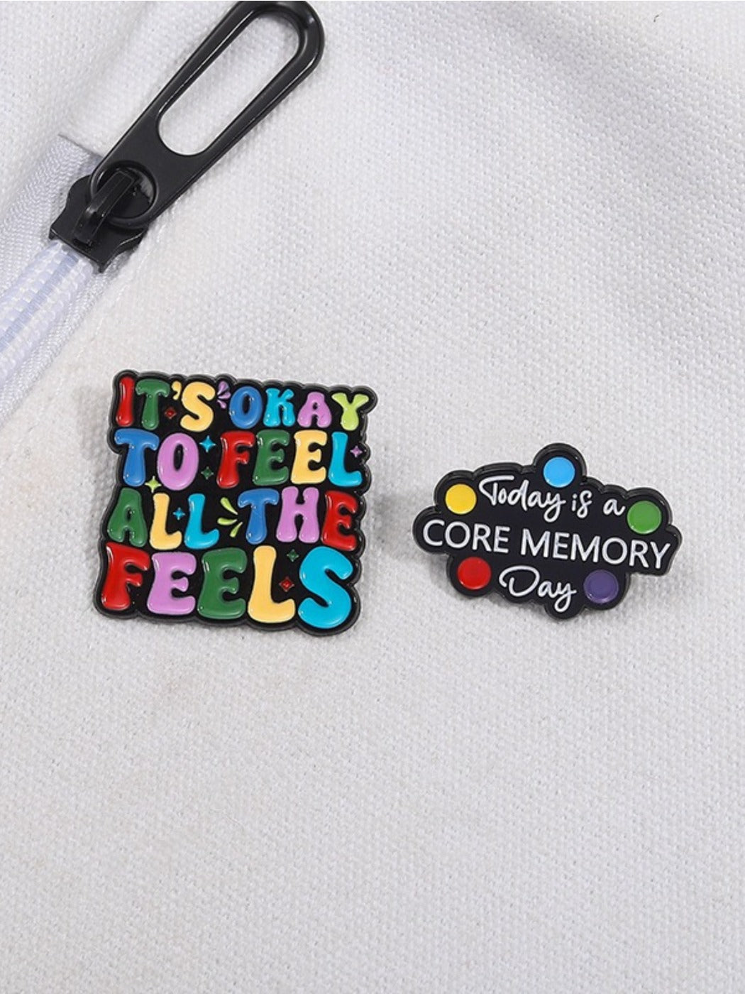 Close-up of lapel pin showing detailed colorful English sentence design