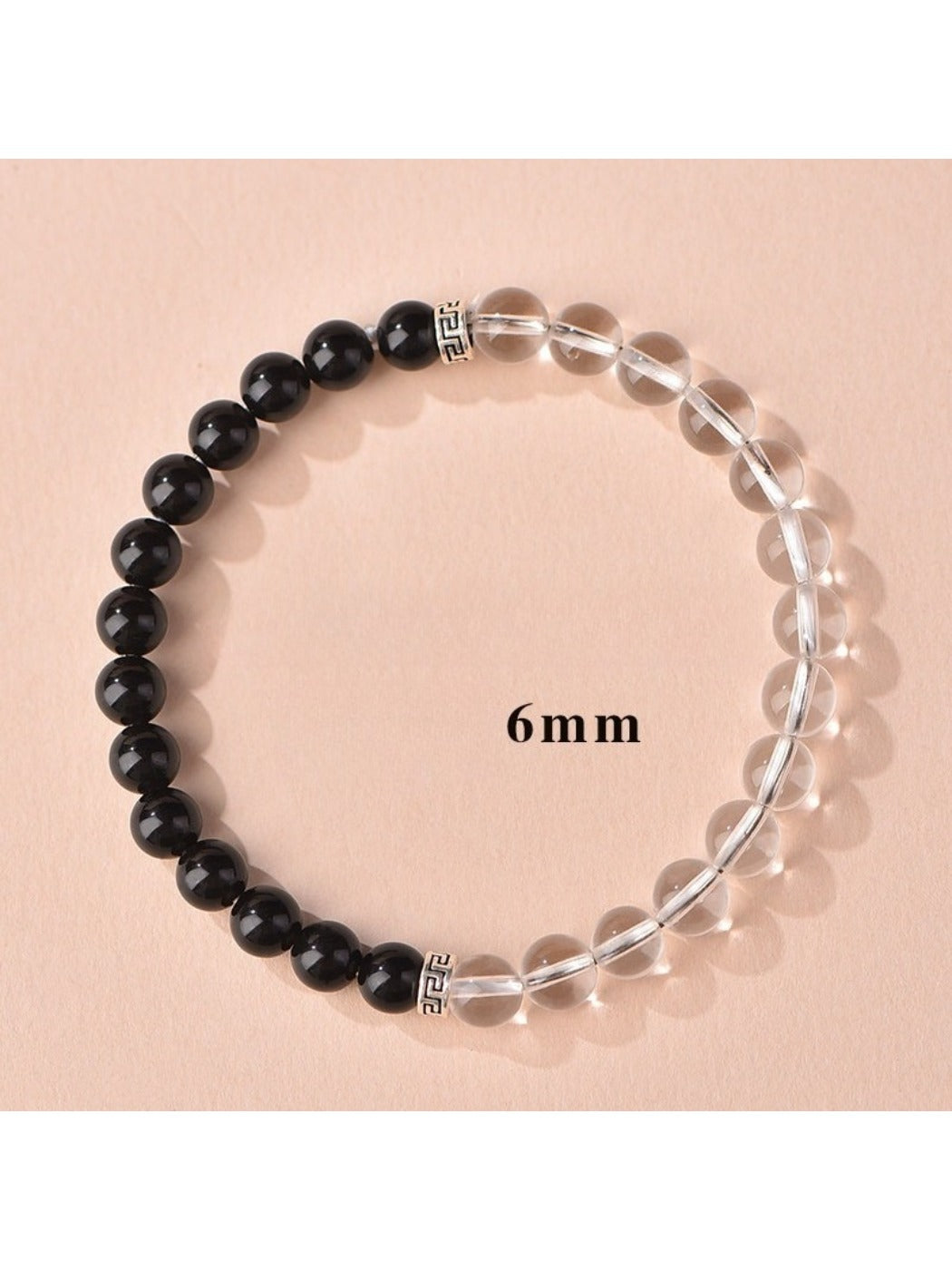 Emora bracelet with white and black beads arranged in a symmetrical pattern