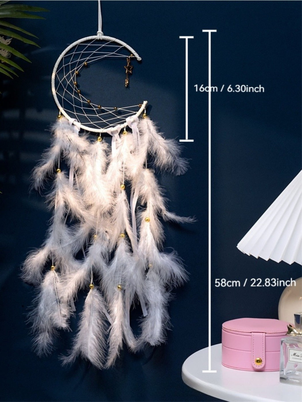Close-up of the colorful beads and natural feathers on the Somnira moon dreamcatcher wind chime