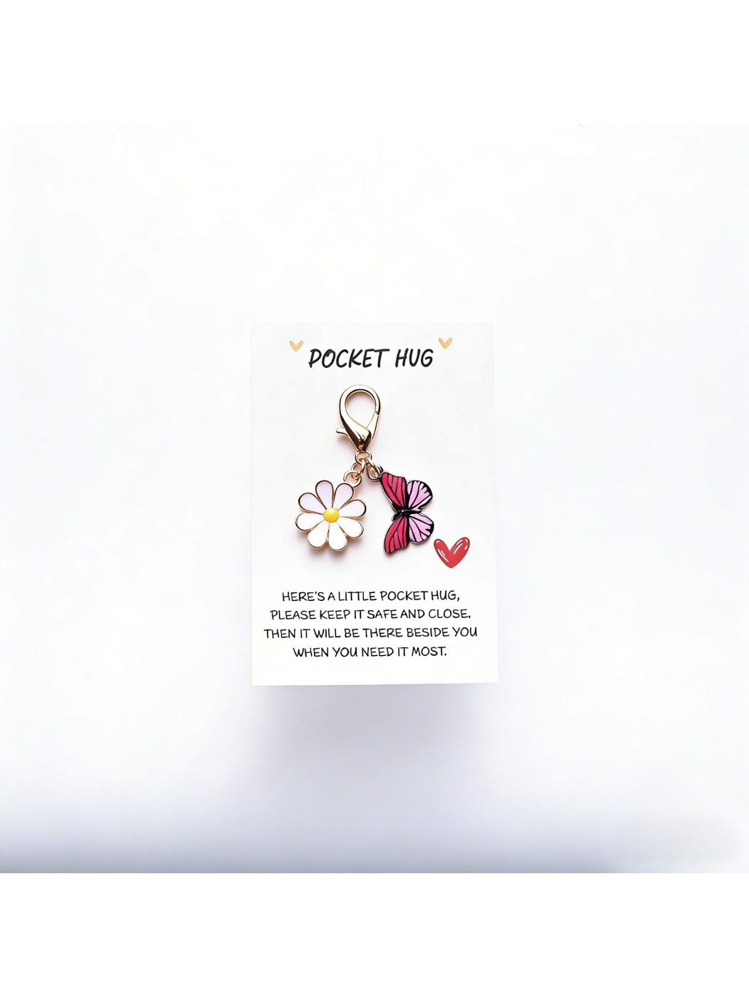 Taphug Pocket Hug Daisy Keychain displayed on a flat surface highlighting daisy charm