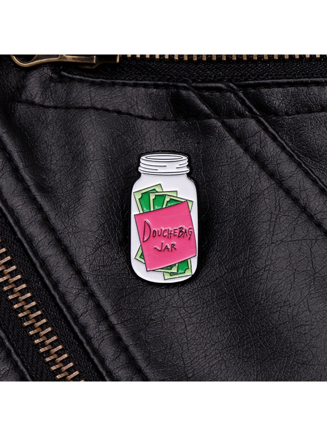 Back view of Pinori Message in a Bottle badge pin showing metal pin clasp