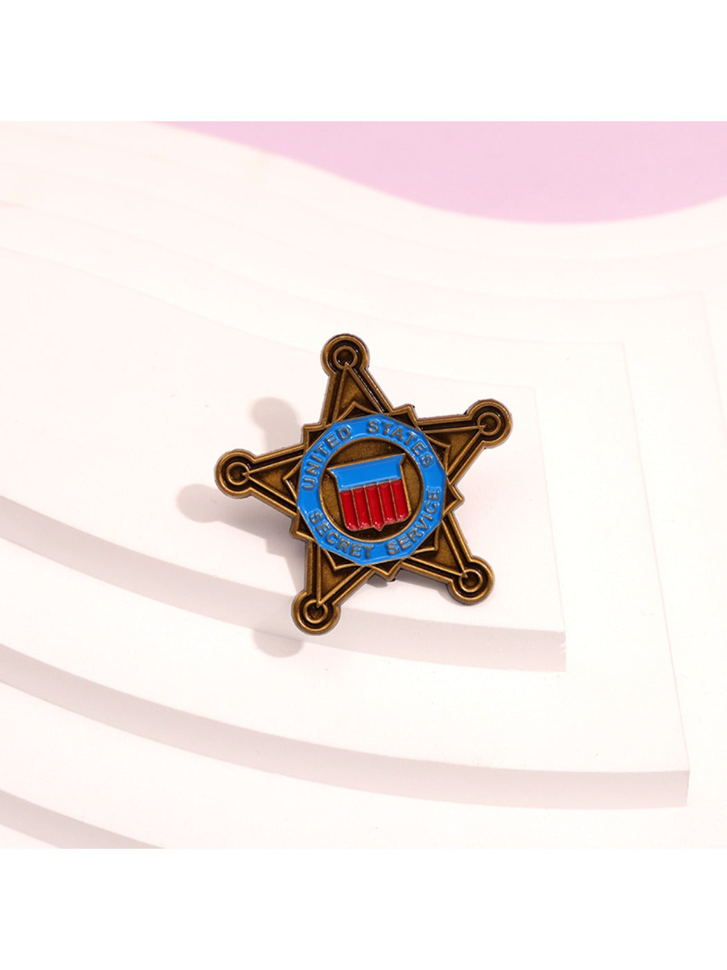 Pinori star brooch displayed on a white background showing front view
