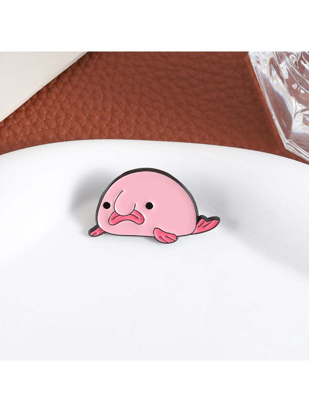 Pinori Sad Pink Blobfish Brooch on white background showing front view