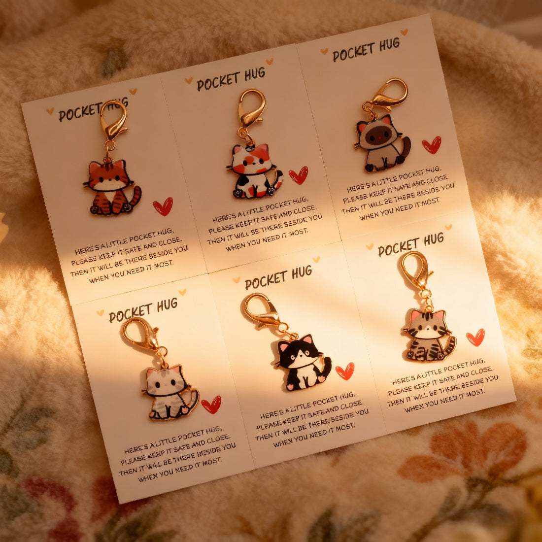 Taphug Kitten Charm Pocket Hug in soft fabric with embroidered kitten face