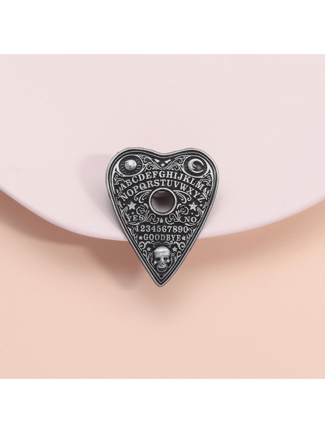 Pinori black metal heart pin badge with punk design on white background