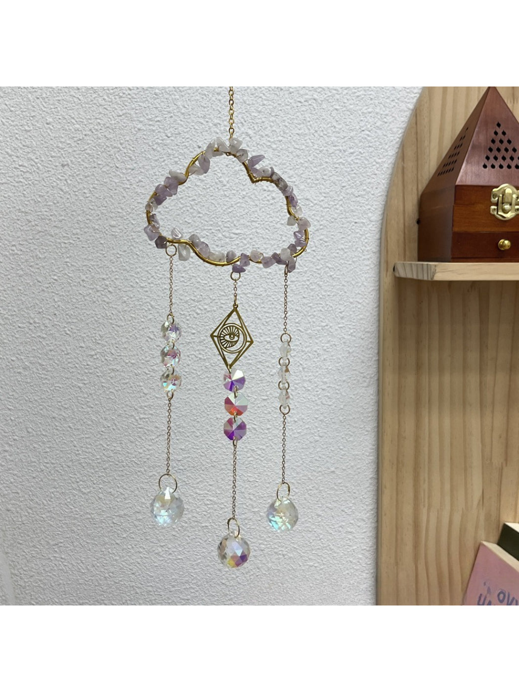 Somnia Cloud Crystal-Look Hanging Sun Catcher hanging indoors near a window