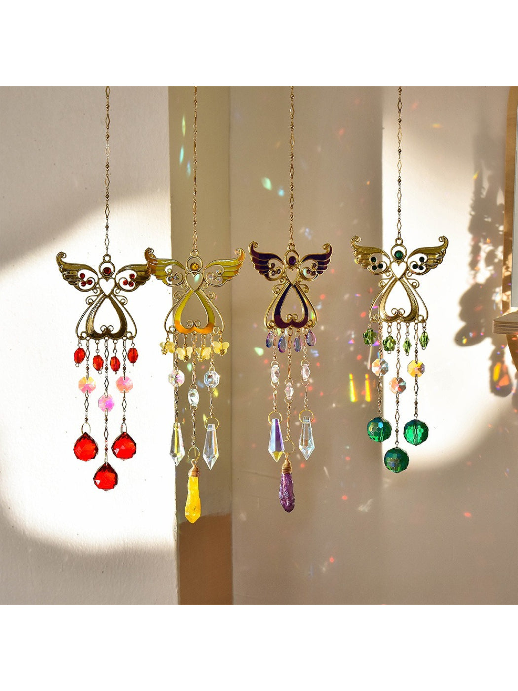 Somnia Angel Wing Crystal Sun Catcher hanging with light reflections