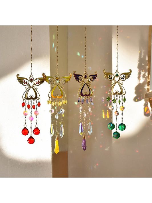 Somnia Angel Wing Crystal Sun Catcher hanging with light reflections