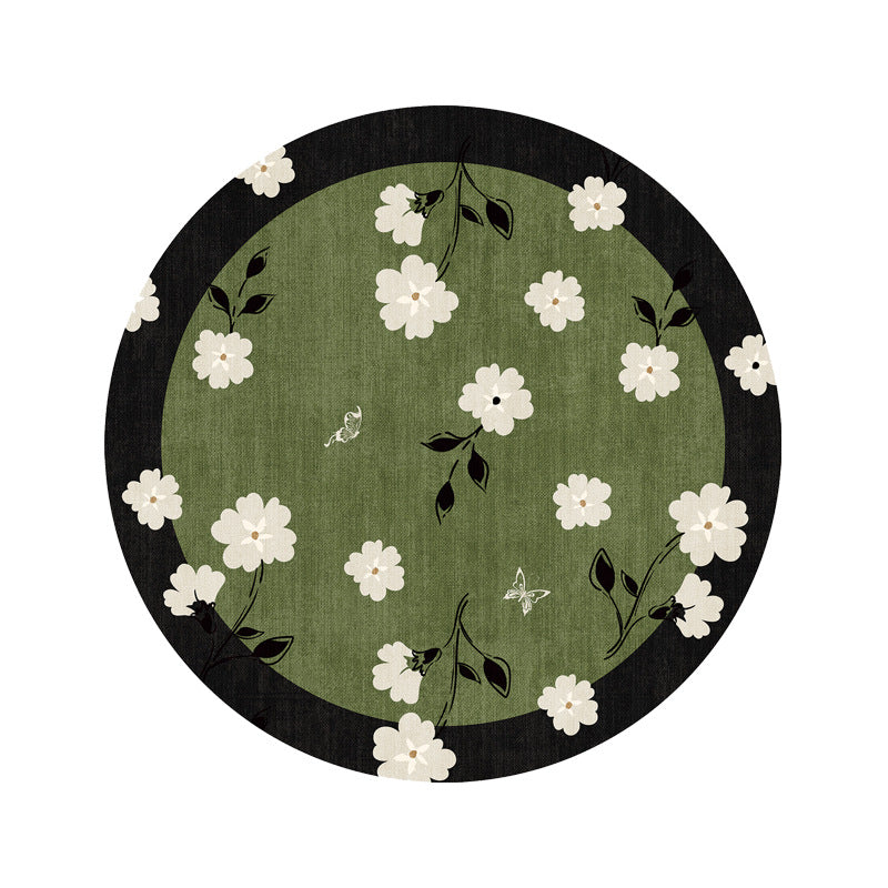 Stack of Thimara vintage style green coaster placemats highlighting color and texture