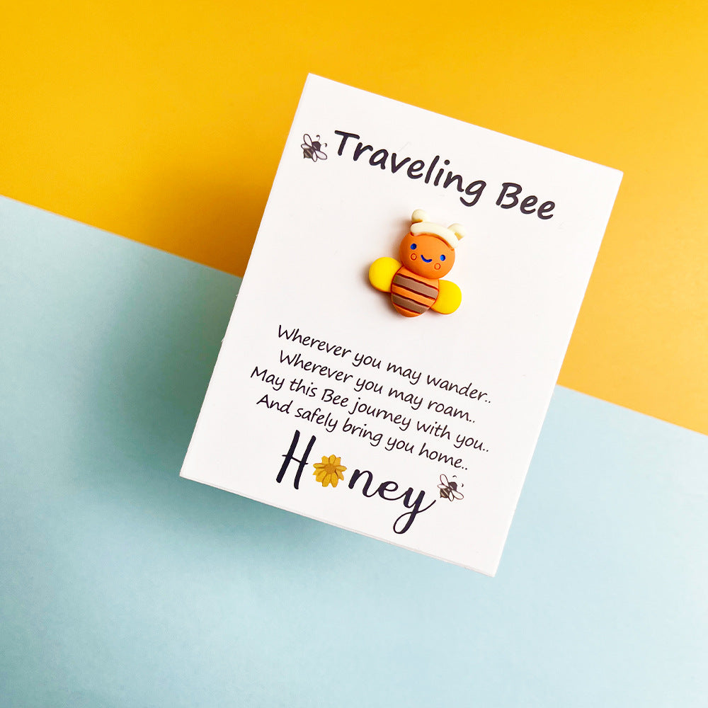 Taphug Pocket Hug Traveling Bee plush toy with tag visible on white background