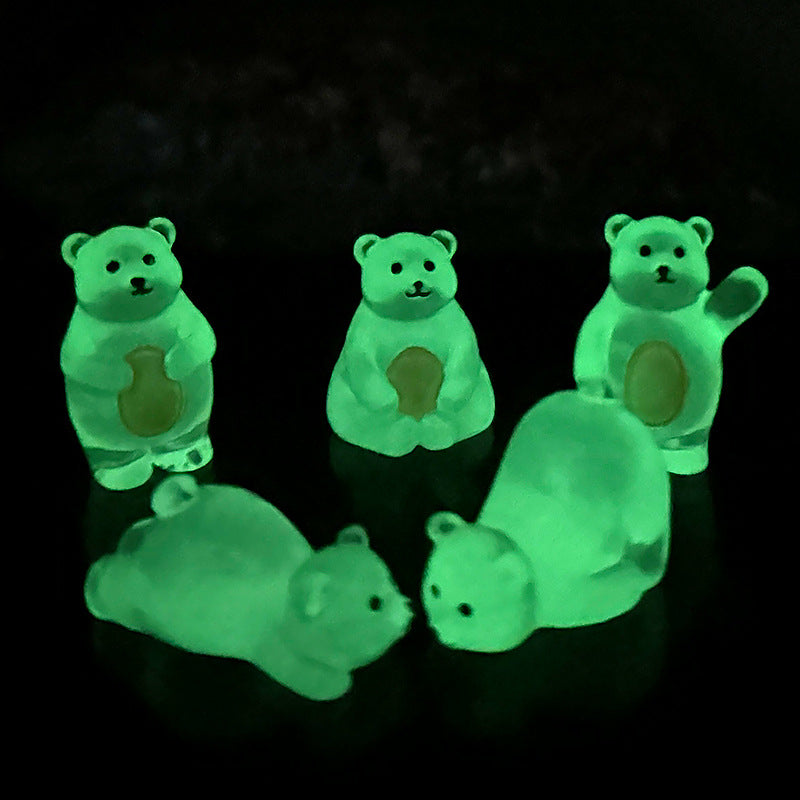Glow-in-the-dark polar bear token on a white surface
