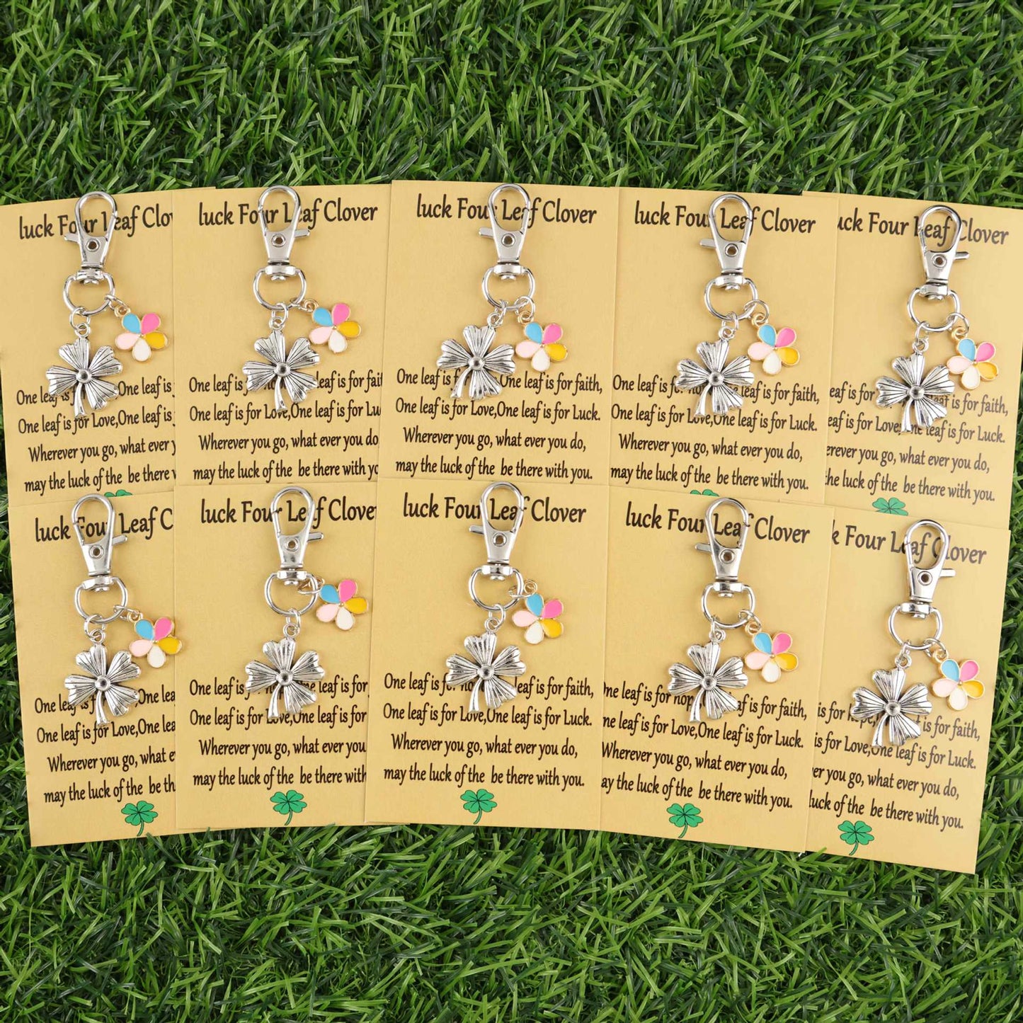 Colorful lucky clover and flower keychains hanging together with metal rings